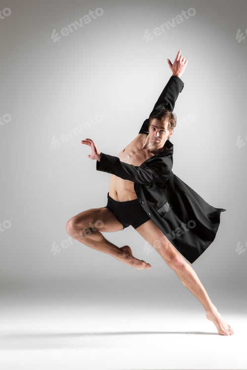 Preview: The young attractive modern ballet dancer on white background
