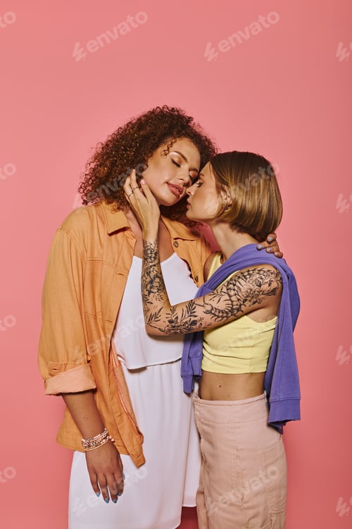 Preview: lesbian couple sharing a sweet moment in a pink studio