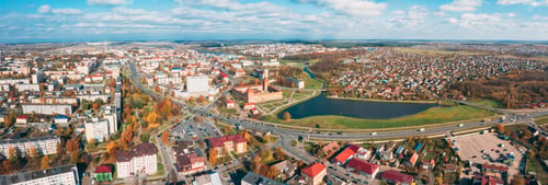 Preview: Lida, Belarus. Aerial Bird's-eye View Of Cityscape Skyline. Lida Castle In Sunny Autumn Day