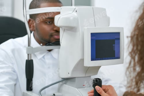Preview: Patient looking at apparatus during vision checking