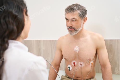 Preview: Doctor and patient communicate before procedure in the clinic