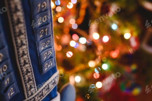 Preview: Christmas advent embroidery calendar with luminous lights background.