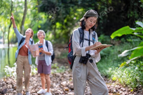 Preview: Backpack tourist travel outdoor adventure bird study using binoculars looking and record to book