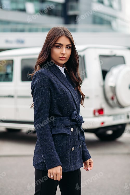 Preview: Beautiful young caucasian woman goes for a walk and poses for the camera