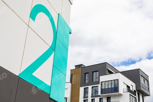 Preview: Close-up of mint-colored number two on dwelling house