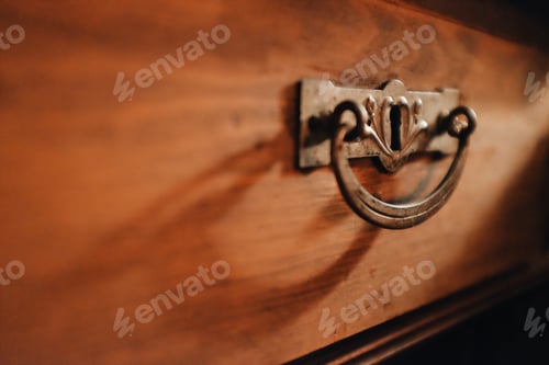 Preview: detail of a handle on a beautiful old wooden cabinet