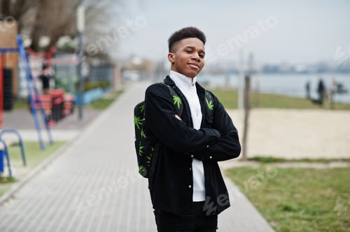 Preview: Young millennial african boy in city