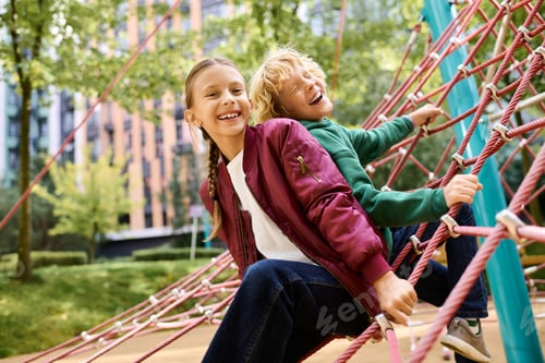 Preview: Joyful children playing on a colorful climbing structure in autumns gentle embrace
