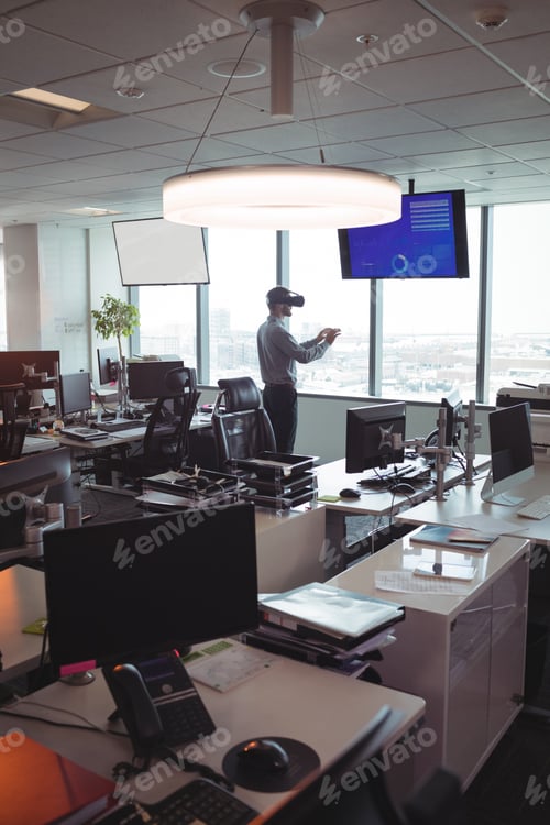 Preview: Businessman using virtual reality technology at office