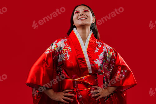 Preview: Young asian woman wearing traditional floral kimono smiling