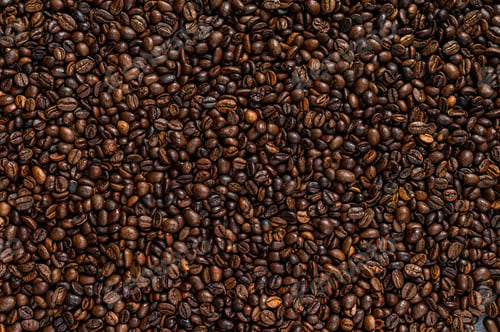 Preview: Roasted coffee beans on rustic table. Black background. Top view