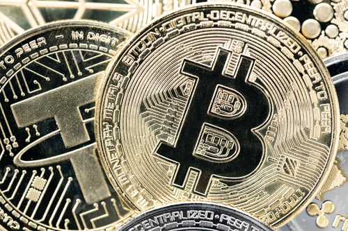 Preview: Bitcoin coin on a variety of crypto coins background. Top view