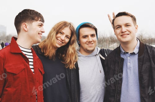 Preview: group of young friends posing arm in arm