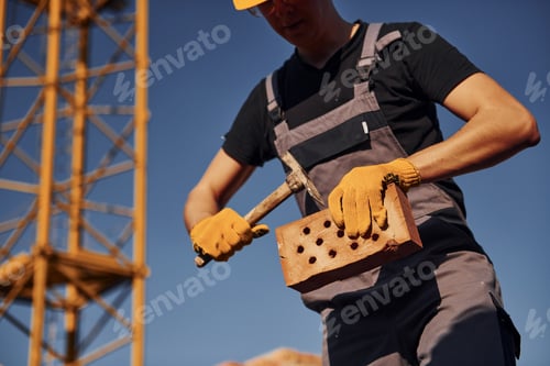 Preview: Construction worker in uniform and safety equipment have job on building