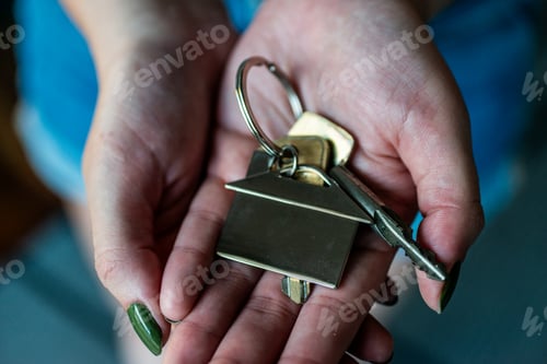 Preview: Close-up shot of hands holding keys.