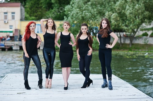 Preview: Five beautiful young sexy girls models in black tight dress posing on pier
