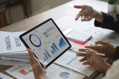 Preview: Business people are meeting for analysis data figures to plan business strategies on digital tablet