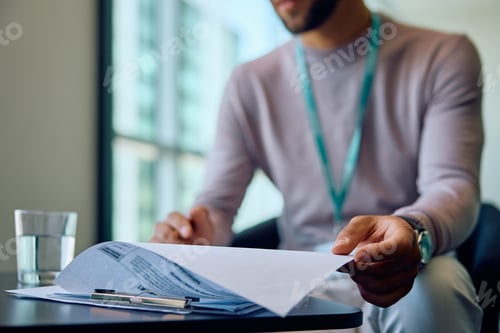 Preview: Close up of entrepreneur working on business reports in the office.
