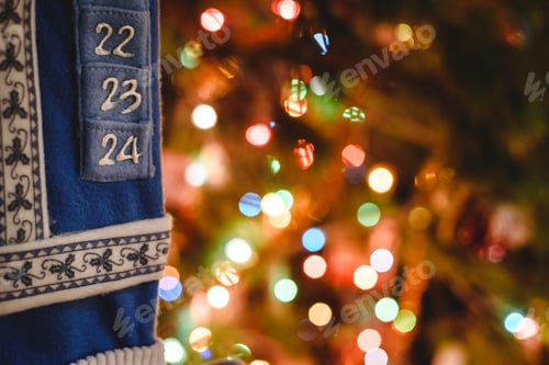 Preview: Christmas advent embroidery calendar with luminous lights background.