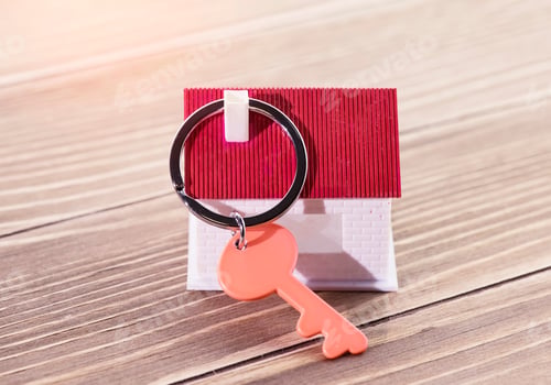 Preview: Key Chain With House Symbol And Keys On Wooden Background,Real Estate Concept