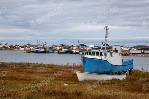 Preview: Scenic view on the small town on the Atlantic Ocean shore with boats parked onshore