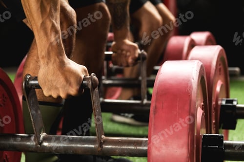 Preview: Male hands with a weights for farmer's walk exercise