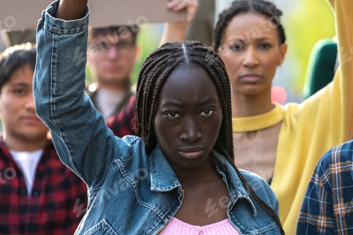 Preview: Determined African woman leads diverse youth protest: solidarity in social justice movement