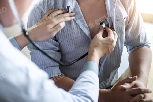 Preview: Doctor using a stethoscope checking patient with examining