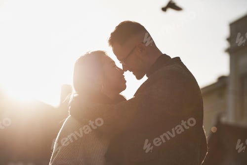 Preview: Beautiful sunlight. Happy multiracial couple together outdoors in the city