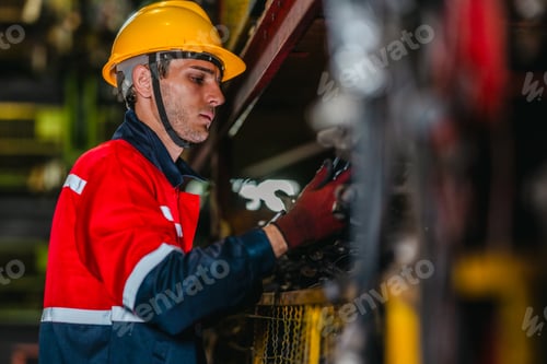 Preview: Technician Using Barcode Scanner and Tablet to Manage Auto Parts Inventory in Warehouse
