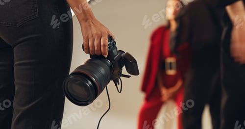 Preview: Hands, photographer and people in studio, camera and pictures for fashion magazine and production.
