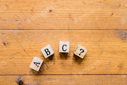 Preview: Wood dice with letters abc and interrogation.