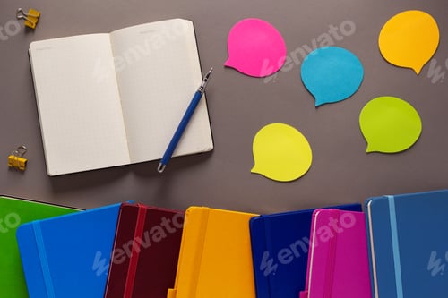 Preview: Open notepad and school stationary supplies at paper table. Back to school flat lay