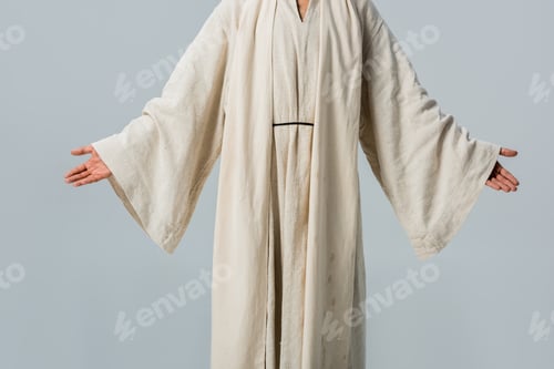 Preview: cropped view of man in jesus robe with outstretched hands isolated on grey