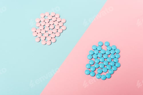 Preview: High angle view of hormonal pills on blue and pink background