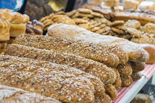 Preview: Freshly wholegrain baguette with grains on stall or in grocery shop