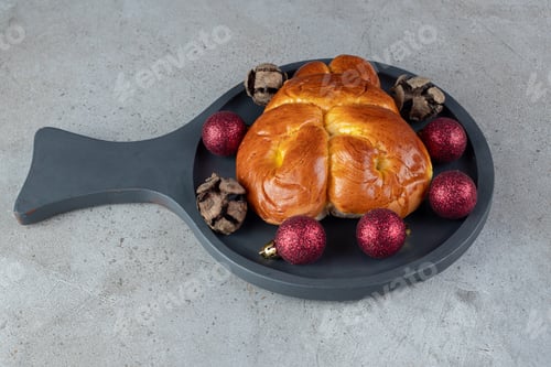Preview: Small serving pan with a sweet bun on marble background