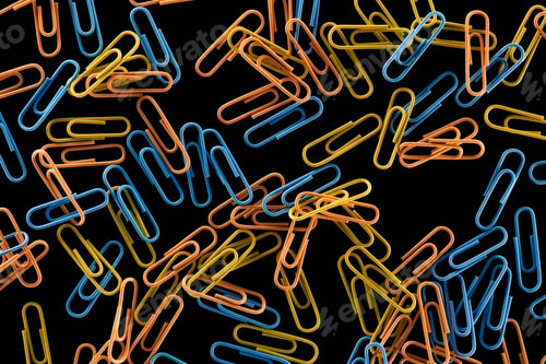 Preview: top view of small yellow, orange and blue paper clips isolated on black