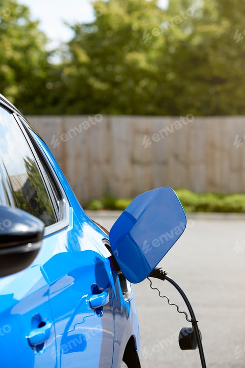 Preview: Charging Cable Attached To Environmentally Friendly Zero Emission Electric Car Outdoors