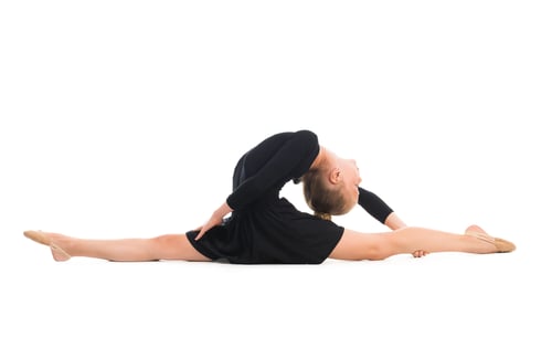 Preview: little gymnast stretching on the floor