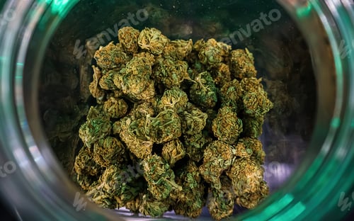 Preview: Marijuana hemp flower buds in glass jar, medical marijuana at dispensary