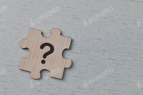 Preview: Question mark drawn on wooden jigsaw puzzle