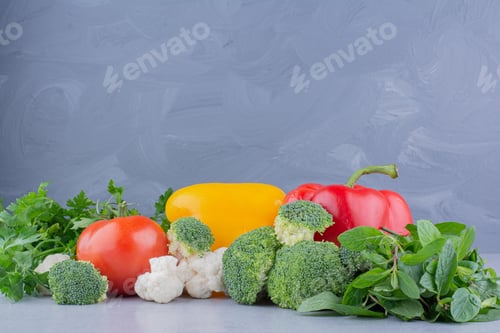 Preview: Pile of vegetables and greens on marble background