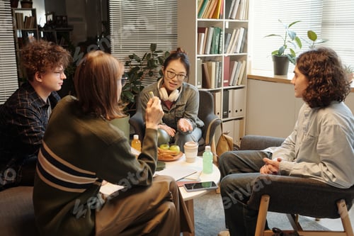 Preview: Group of Four People Chatting With Friends in School Lounge