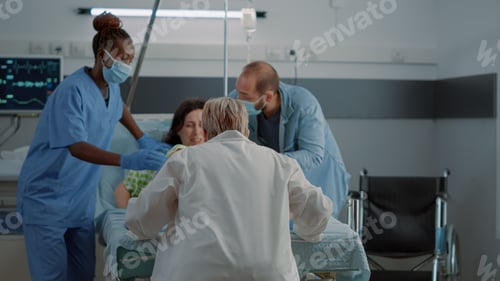 Preview: Obstetrics doctor and african american nurse delivering child