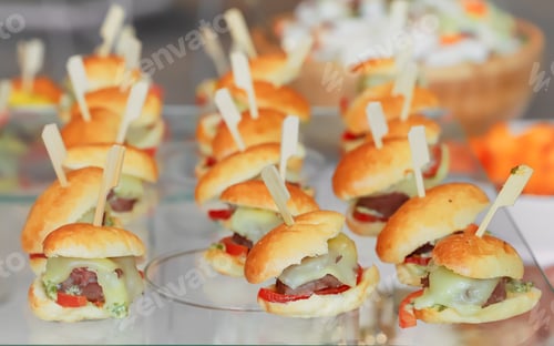 Preview: catering buffet with variety of food snacks and appetizers.