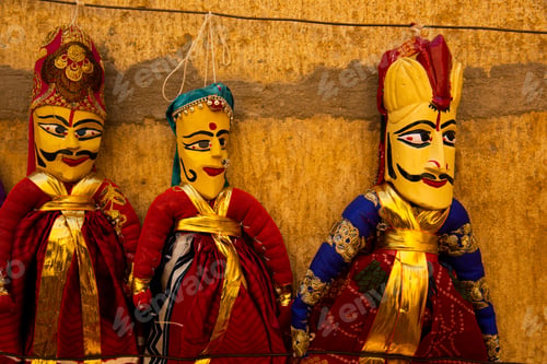 Preview: Colorful Rajasthani puppets hanging in the street of Jaisalmer, India.
