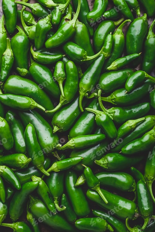 Preview: Top View of Green Jalapeno Peppers. Background