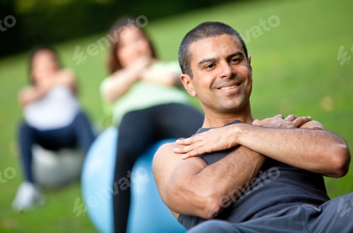 Preview: Group Of People In A Pilates Class Outdoors