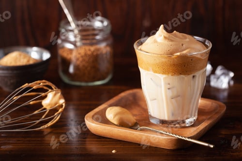 Preview: dalgona coffee in glass. trendy Instant coffee whipped with sugar and hot water